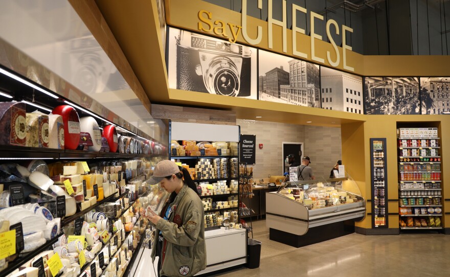 Shoppers flock to the opening of the Whole Foods in Brighton on Wednesday, April 12, 2023.