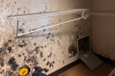 A photograph from an August 2026 Government Accountability Office report shows suspected mold in a barracks closet at Naval Station Norfolk.
