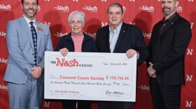George Roberts, second from right, accepting a check from the Nash in January with his wife Margaret Roberts, Nash Assistant General Manager Nash Assistant General Manager Aaron Feinberg, left, and Director of Security Robert Page, right.