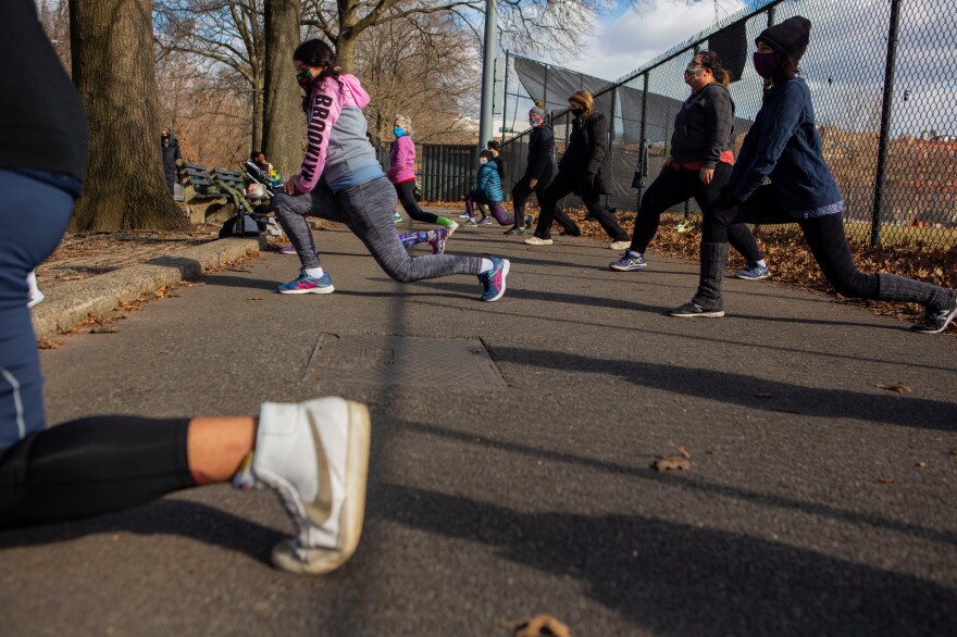 Students stretch at the end of the Zumba class.