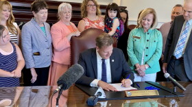 Gov. Chris Sununu signs the law.