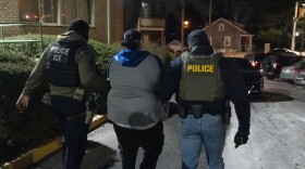 U.S. Immigration and Customs Enforcement officers detain a person, Monday, Jan. 27, 2025, in Silver Spring, Md. (AP Photo/Alex Brandon)
