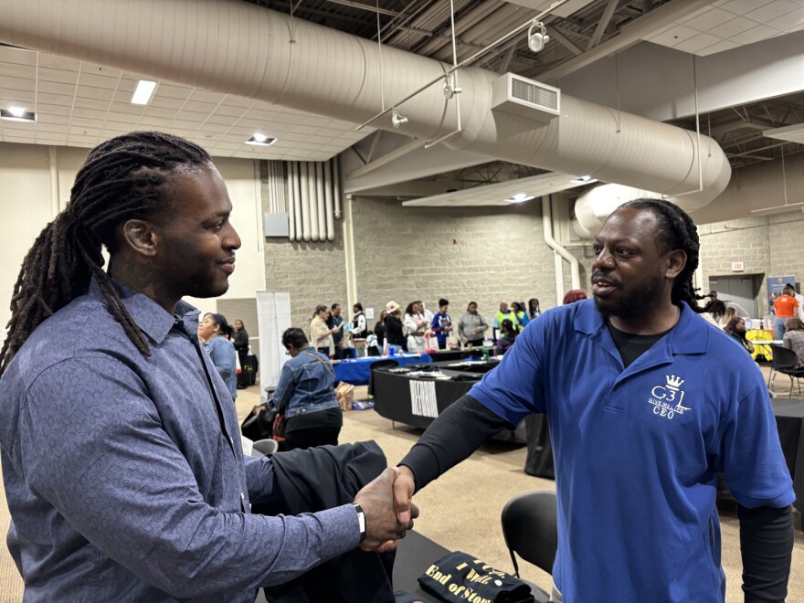 Christopher Cooksey, left, and Robert Webster, right, talk about opportunities with Give Me Life. The organization operates two transitional housing locations for recently incarcerated people.
