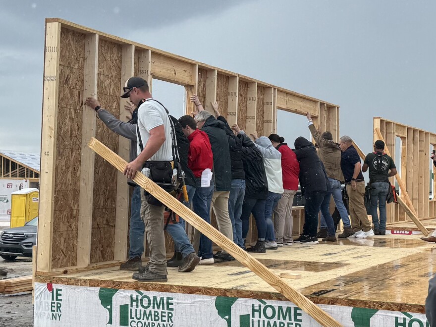 Governor Andy Beshear, state and local leaders, construction teams and volunteers raise the wall at Skyview in Hazard