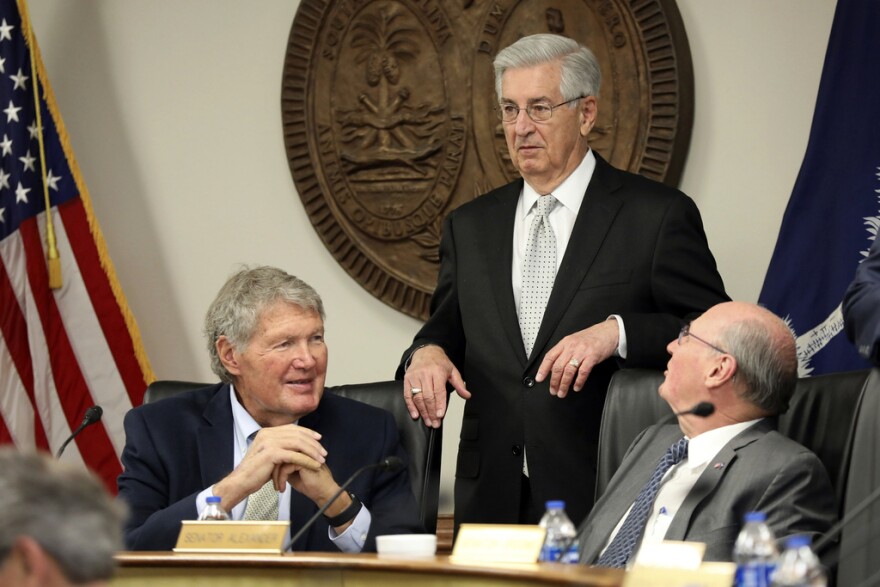 South Carolina Senate Finance Committee Chairman Harvey Peeler, R-Gaffney, left, state Sen. Nikki Setzler, D-West Columbia, center, and Senate President Thomas Alexander, R-Walhalla, right, speak before a Senate Finance Committee meeting on the state's $13 billion budget, Tuesday, April 4, 2023, in Columbia, S.C. (AP Photo/Jeffrey Collins)