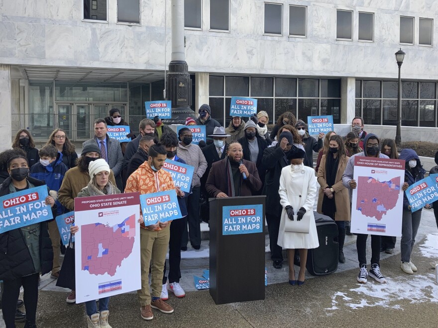 Advocates rally outside the Ohio Supreme Court on Dec. 8, 2021, in Columbus. Justices have struck down three versions of Republican-drawn state legislative maps for being unconstitutional.