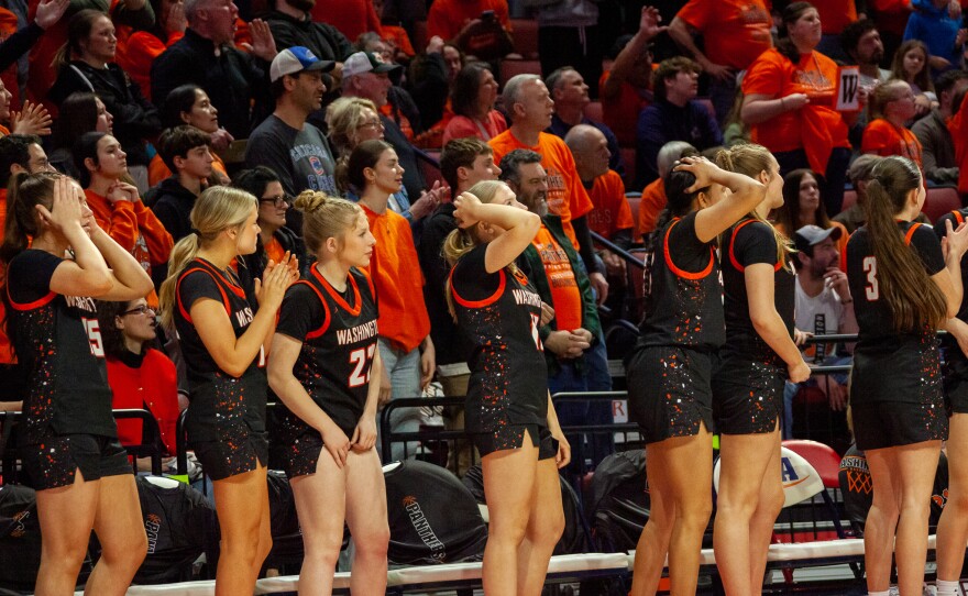 Girls high school basketball players inside an arena