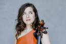 Portrait of cellist Alisa Weilerstein with her cello.