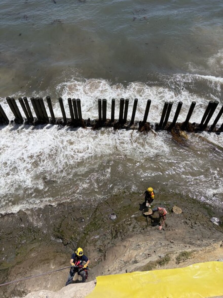 Two people were rescued after they became trapped by the surf on Santa Barbara County's coastline Sunday.