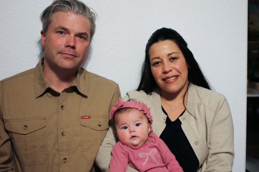 Stephen and Yurany Dexter hold their 4-month-old daughter, who was recently hospitalized for botulism, at their home in Flagstaff, Ariz. on Wednesday, Nov. 12, 2025.
