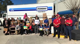 Volunteers pose for a picture Wednesday morning before loading the truck with supplies for Hurricane Michael victims in Fountain.