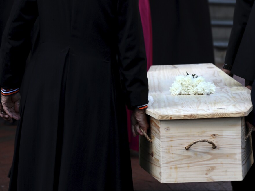 The coffin carrying Anglican Archbishop Emeritus Desmond Tutu is carried into the St. George's Cathedral.