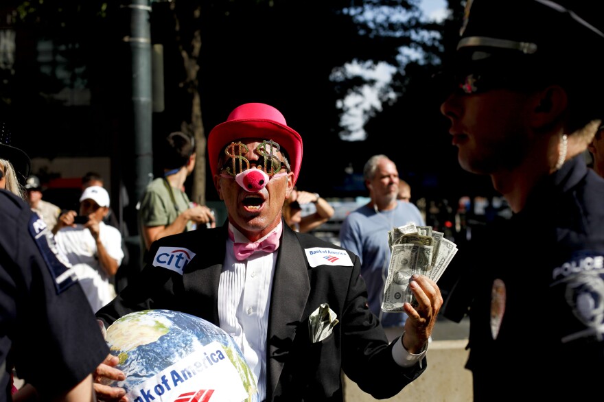 Members of Code Pink dressed as members of the 1 percent to protest.