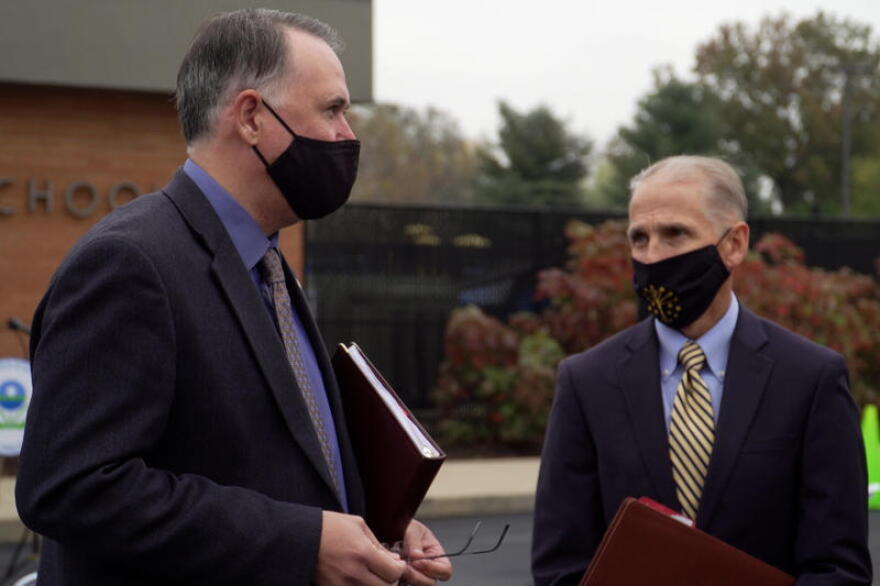 EPA Region 5 Administrator Kurt Thiede (left) and Jim McGoff with the Indiana Finance Authority (right) in front of North Grove Elementary School in Greenwood.