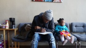 A Jamaa Birth Village client fills out paperwork at the Ferguson clinic in March. Mercy Health has pulled midwifery services from a planned Ferguson clinic after a dispute with Jamaa founder Tru Kellman. 