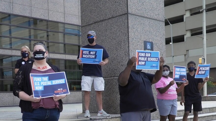 About15 people rallied, starting at Sen. Todd Young's office at 12:30 p.m. before moving to Sen. Mike Braun's office.