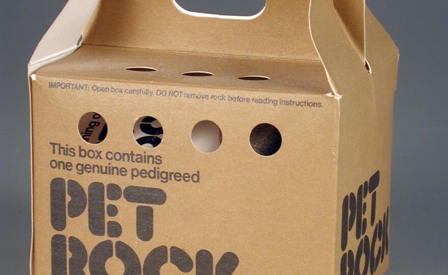 A light brown cardboard box with dark brown letters.