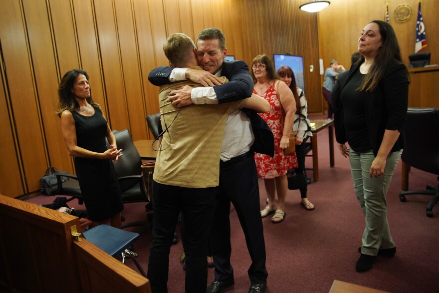  A jury in Cuyahoga County found Michael Buehner not guilty of murder on July 19, 2023, two years after his two-decade-old conviction was overturned by an Ohio appeals court. Michael Buehner hugs his son Ryan Buehner after being found not guilty.