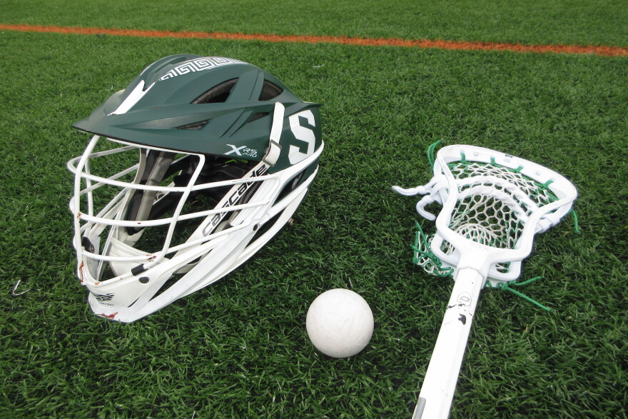MSU men’s lacrosse equipment rests on the turf as players prepare for another season of training.