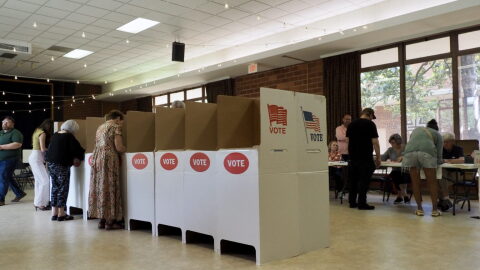 Voters mark their ballots in the Crown Heights Christian Church on June 16, 2026 in Oklahoma City.