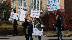 People protest outside the offices of the New Mexico Public Education Department's office in Albuquerque, New Mexico. Supporters say the new curriculum, which includes ethnic studies, is "anti-racist." (Cedar Attanasio/AP Photo)