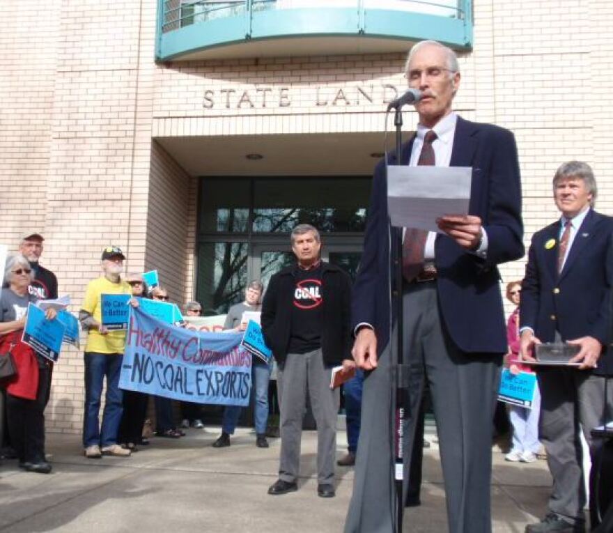 Andy Harris with the group Physicians for Social Responsibility speaks at a rally against coal export terminals outside a meeting of the Oregon State Land Board in Salem