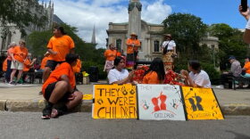 Members of the Onondaga Nation in the shadow of Syracuse's statue of Christopher Columbus during a rally Saturday, July 31, 2021