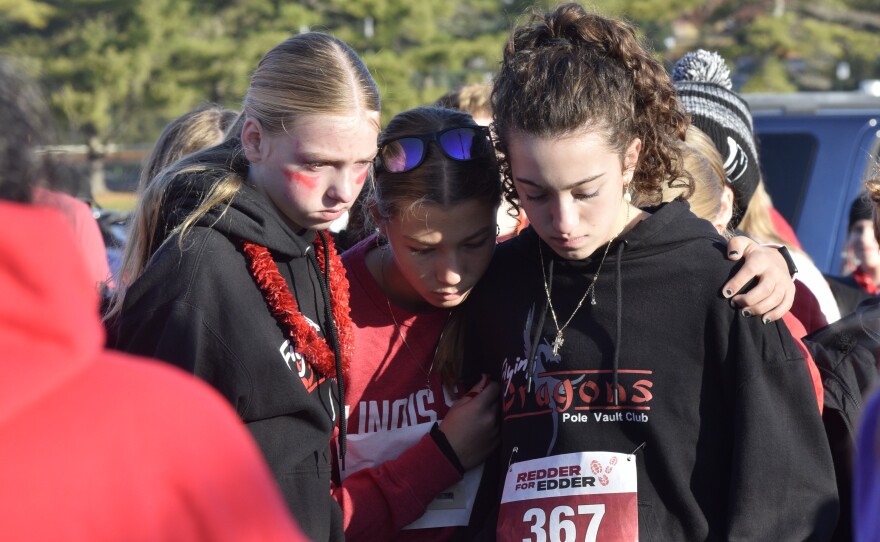 A group of participants waiting for the start of the Redder for Edder Run/Walk on Saturday, Nov. 22, 2025, listened to Edder Diaz' family members speak during a Gift of Hope flag-raising ceremony before the race. The flag raising honored Edder as an organ donor. The Parkside Junior High School seventh-grader died Nov. 8, from injuries suffered in a house fire earlier that week.