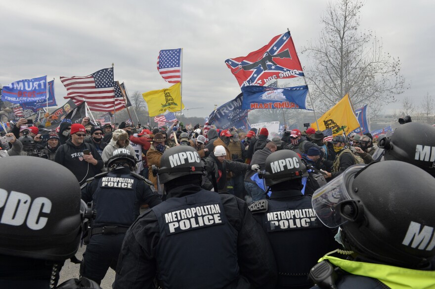 Pro-Trump extremists clash with police and security forces as they storm the U.S. Capitol.