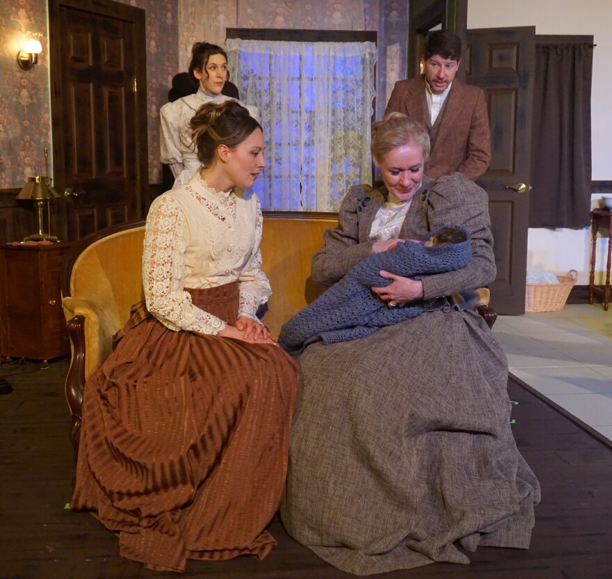 Gathered in the living room with the baby.