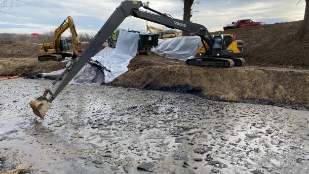 Crews work on oil recovery at Mill Creek in northern Kansas on Dec. 28, 2022.
