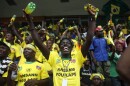 Fans of Brazil's soccer team cheer during the South Africa 2010 World Cup match between Brazil and Ivory Coast as they watch the game from Sylvio Cator stadium in Port-au-Prince, Sunday, June 20, 2010. (AP Photo/Alexandre Meneghini)