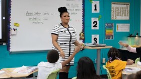 Third grade teacher Alexis McCane coaches students through a reading passage at Tulsa Public School's Anderson Elementary.