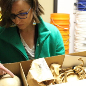 Forensic Anthropologist Kate Spradley examines the remains of an unidentified migrant.