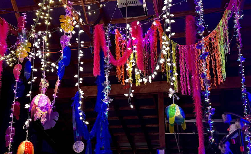 Color vines hanging with lights from the ceiling 