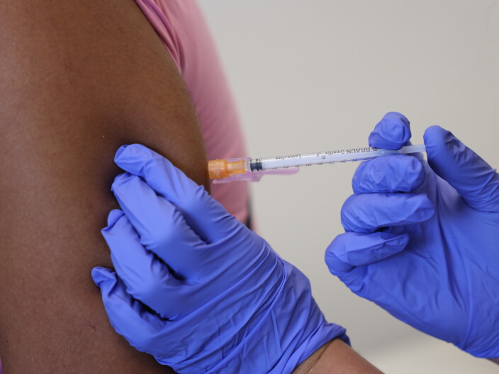 A doctor administers a dose of the monkeypox vaccine.