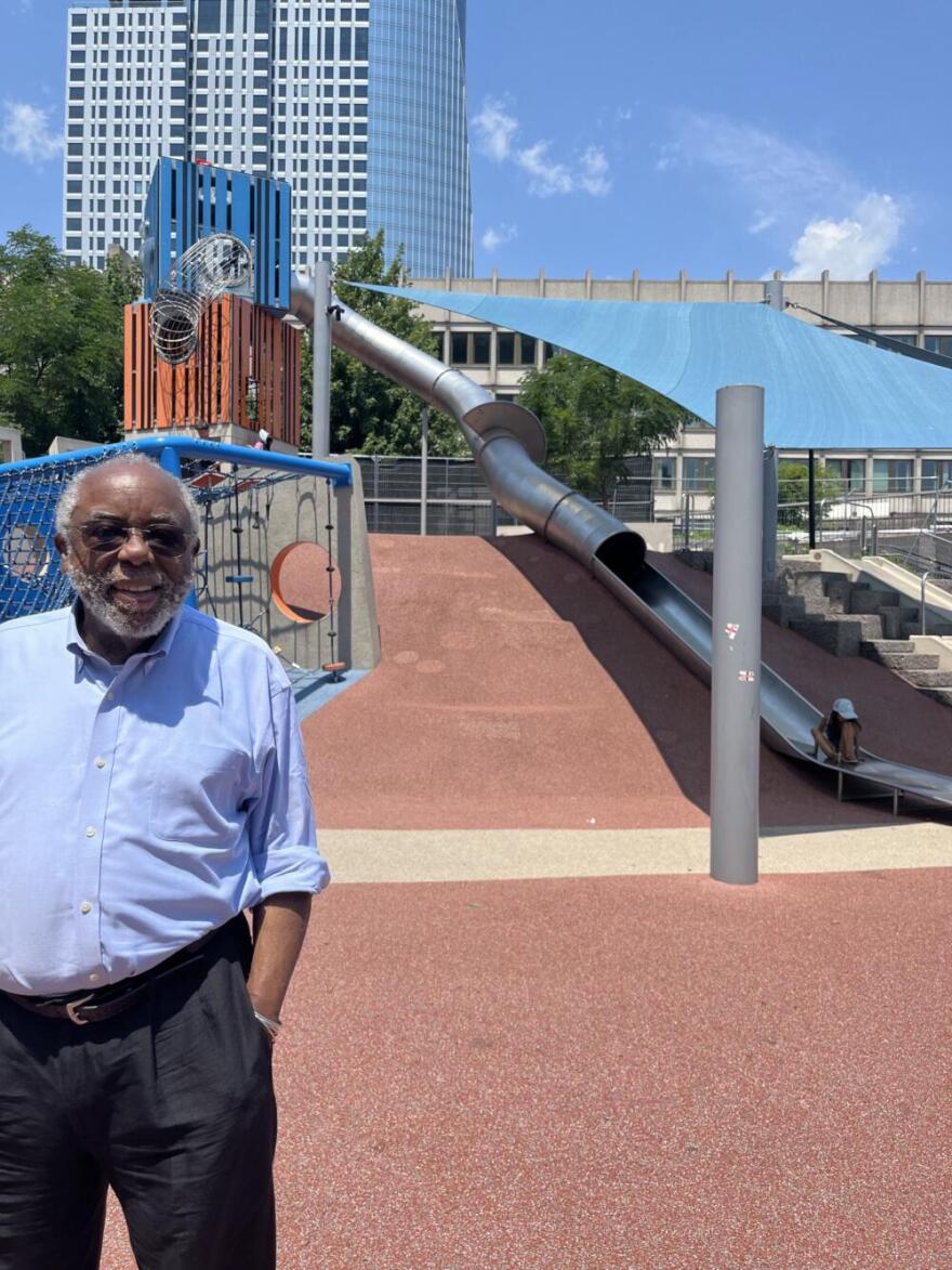 Ted Landsmark in front of the "cop slide" in Boston City Hall Plaza, 50 years after he was attacked. (Robin Young/Here & Now)