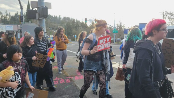 Students march through downtown Springfield to Springfield School District's headquarters to protest mid-year layoffs.