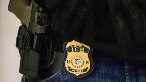 A federal agent wears an Immigration and Customs Enforcement badge at the immigration court at Jacob K. Javits Federal Building in New York, on Monday, June 9, 2025. (Yuki Iwamura/AP)