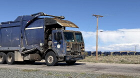 Garbage trucks wait in line to dump trash at the Cerro Colorado Landfill Wednesday afternoon after heavy rain forced the site to close Tuesday.