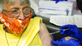 Linda Busby, 74, stiffens up as she receives a shot of the Janssen COVID-19 vaccine at the Aaron E. Henry Community Health Service Center, Wednesday, April 7, 2021, in Clarksdale, Miss. The Mississippi Department of Human Services is in the initial stages of teaming up with community senior services statewide to help older residents get vaccinated. (AP Photo/Rogelio V. Solis, File)