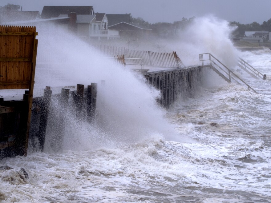 Waves pound a seawall in Montauk, N.Y., Sunday, Aug. 22, 2021, as Tropical Storm Henri affects the Atlantic coast.