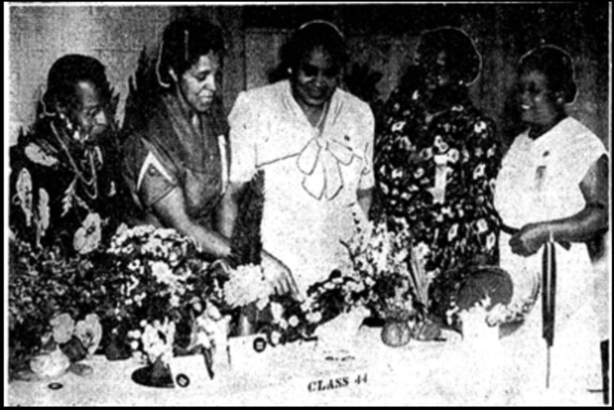 Ethel Clark, center, judges a garden club flower show. Mrs. Clark was the only woman among the 1932 cofounders of the Negro Garden Club of Virginia.