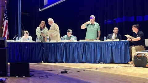 Two of the newest Archbald council members, standing, from left: Lisa Osborne and Larry Marchetti, are seen after the fifth conditional use hearing for the Wildcat Ridge Data Center Campus planned for the borough, held Monday, June 15, 2026.