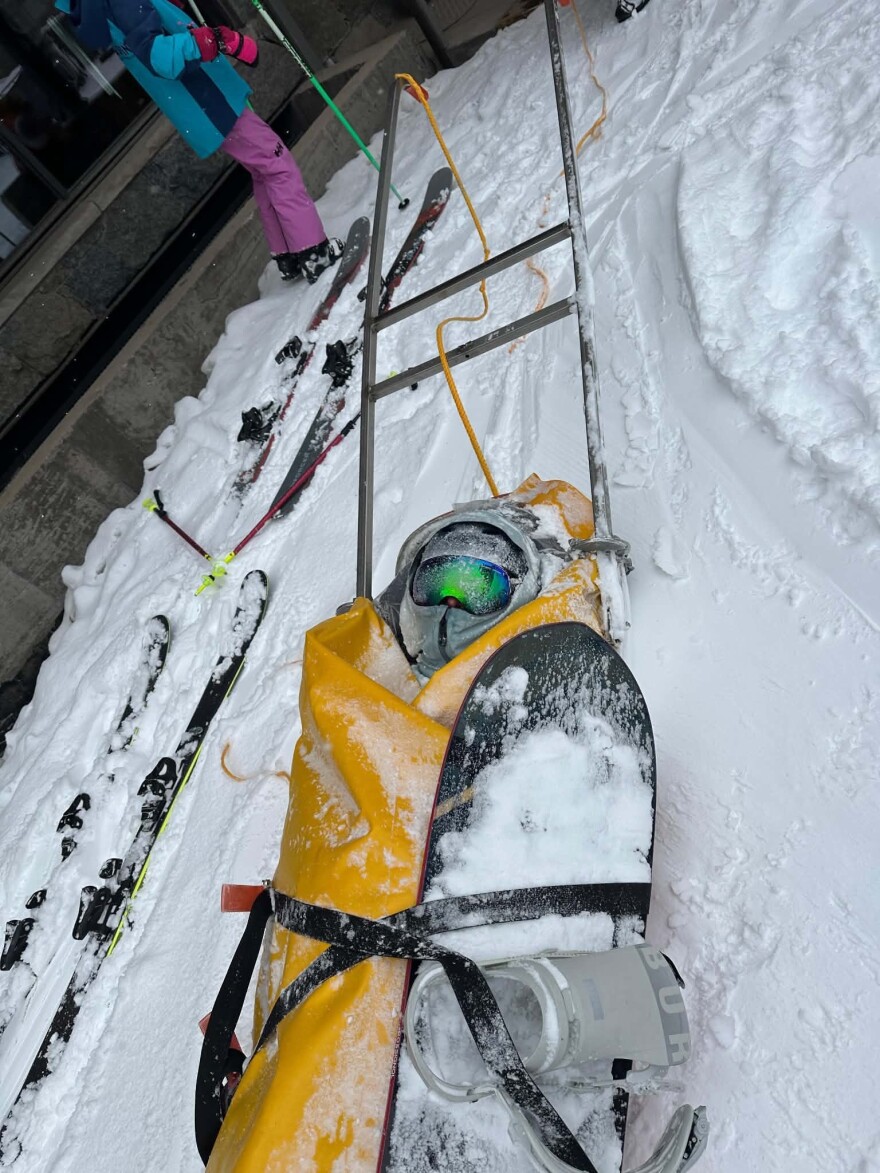 Ski patrollers carry Nico Heins down the Snowmass Ski Area in a toboggan after he sustained a leg injury in February 2026. Heins had to be rescued off the mountain after he collided with a skier and broke his leg.