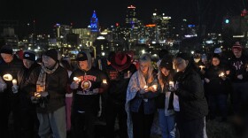 People attend a candlelight vigil for victims of a shooting at a Kansas City Chiefs Super Bowl victory rally, Thursday, Feb. 15, 2024 in Kansas City, Mo.
