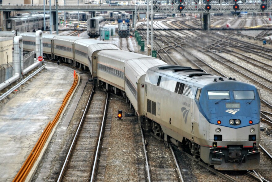 An Amtrak train pulls out of Chicago's coach yard and maintenance facility.