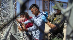 Migrants are pat down by a Border Patrol agent as they enter into El Paso, Texas from Ciudad Juarez, Mexico, Wednesday, May 10, 2023. President Joe Biden’s administration on Thursday will begin denying asylum to migrants who show up at the U.S.-Mexico border without first applying online or seeking protection in a country they passed through, according to a new rule released Wednesday, as U.S. officials warned of difficult days ahead as a key limit on immigration is set to expire. (AP Photo/Andres Leighton)