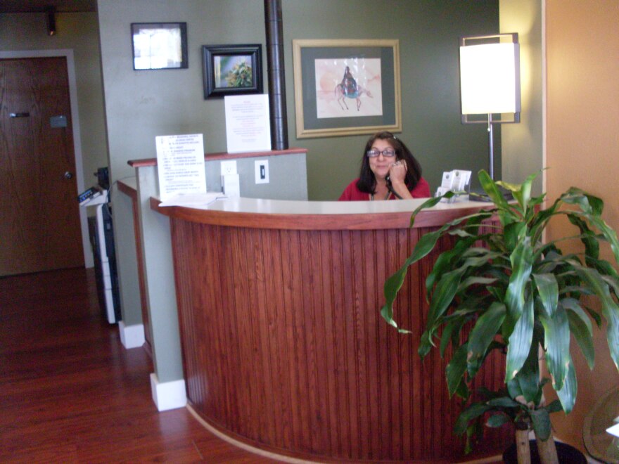 Bobbi Jordan answers questions at Infinite Wellness Center, which is planning for its last day of business on Feb. 13.
