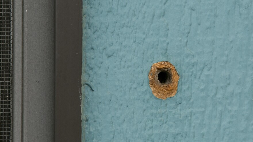 A bullet hole is seen in an exterior wall at the Rancho Tehama Elementary School on Nov. 15, 2017. Gunman Kevin Janson Neal is believed to have spent six minutes shooting into the school before driving off to continue his shooting spree. One student was wounded by gunfire and a second by flying glass.